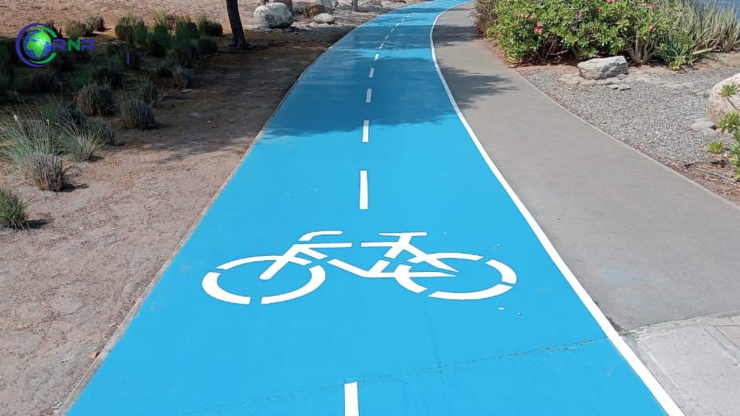 RNR team applying blue epoxy coating on the Al Mouj cycling track